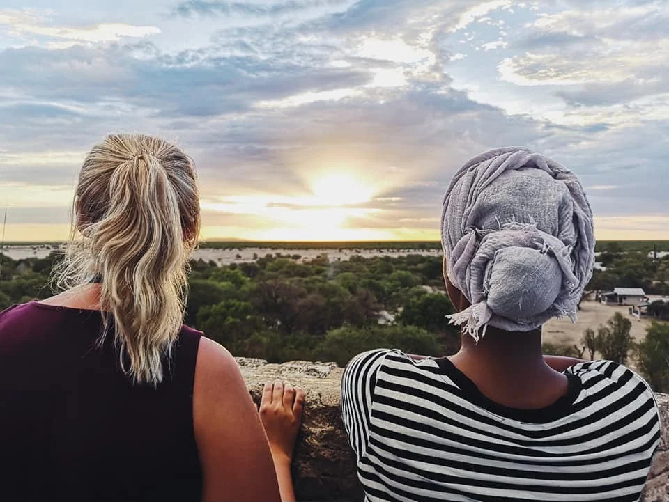 Two students enjoying a Namibian sunset together